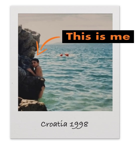 Alan Cie as a young boy struggling to climb a rock, scared of falling water